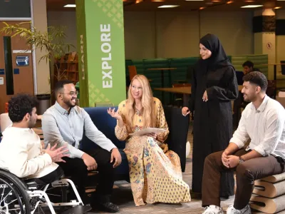 Two students having conversation with accessibility services specialist