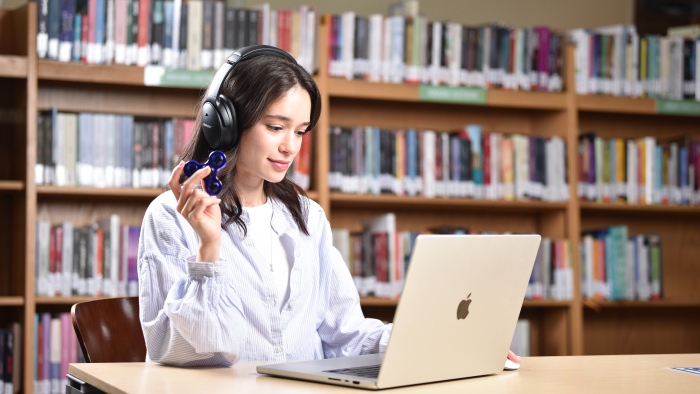 Image of a student using Assistive Technology