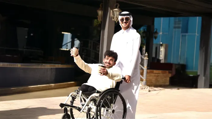 Two students celebrating accessibility