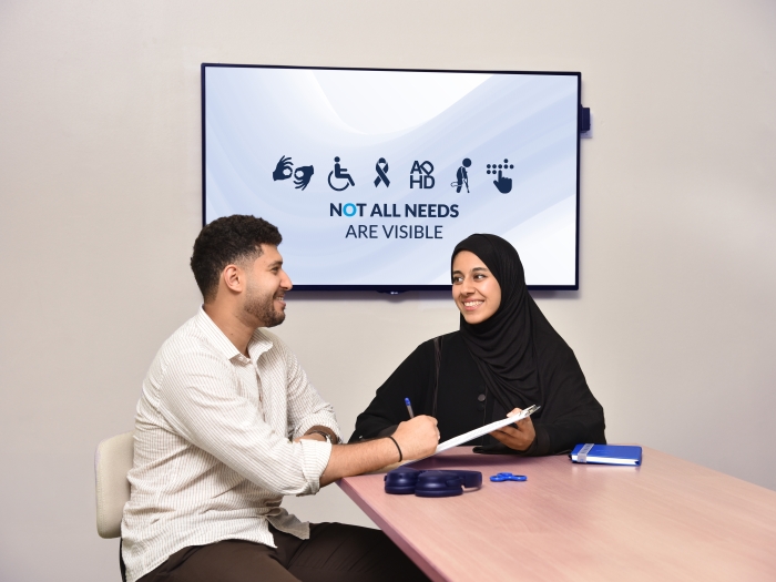 student having conversation with accessibility services specialist