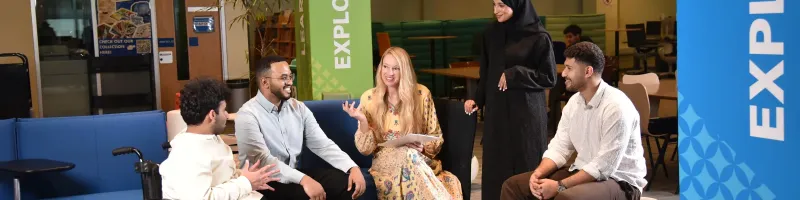 Two students having conversation with accessibility services specialist