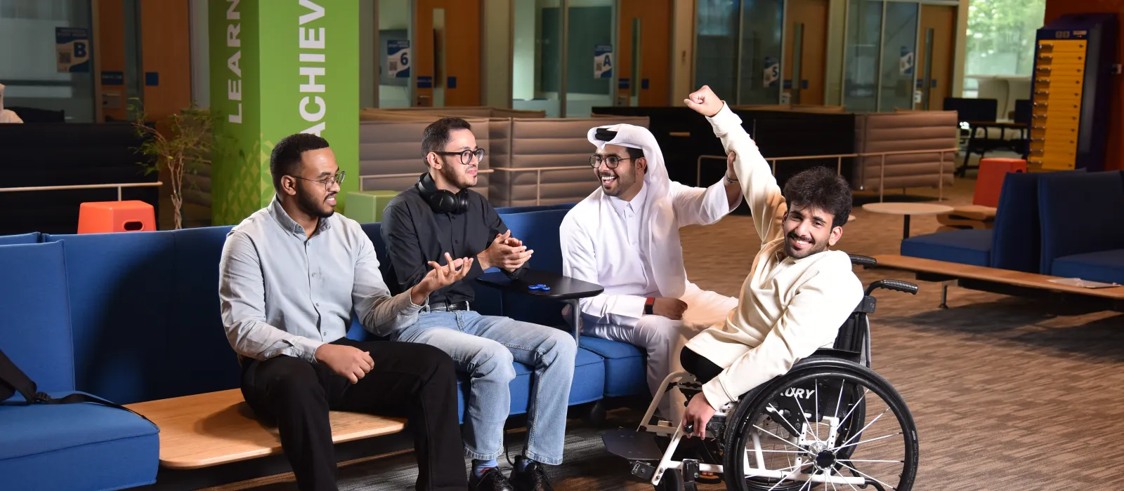 Group of 4 university students posing for a photo