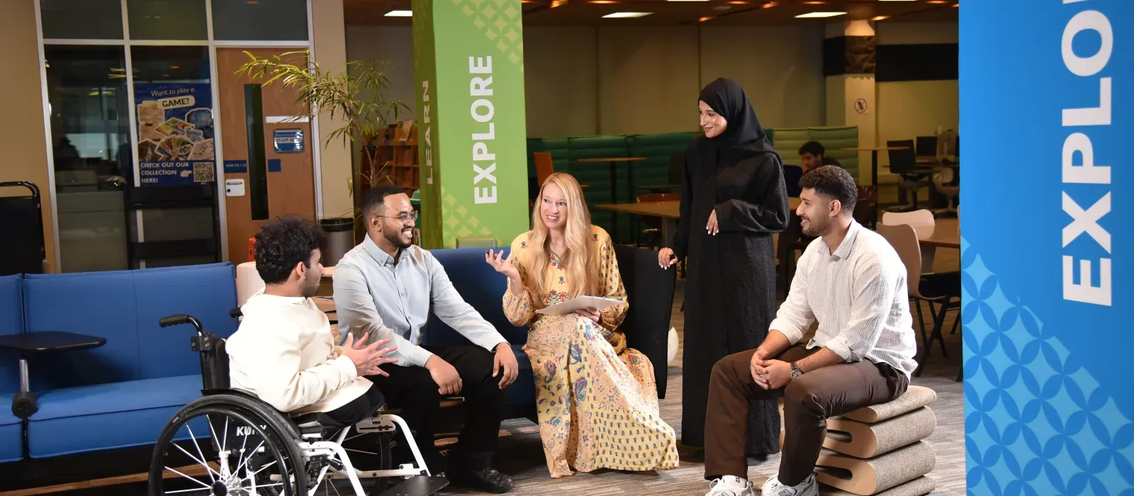 Two students having conversation with accessibility services specialist